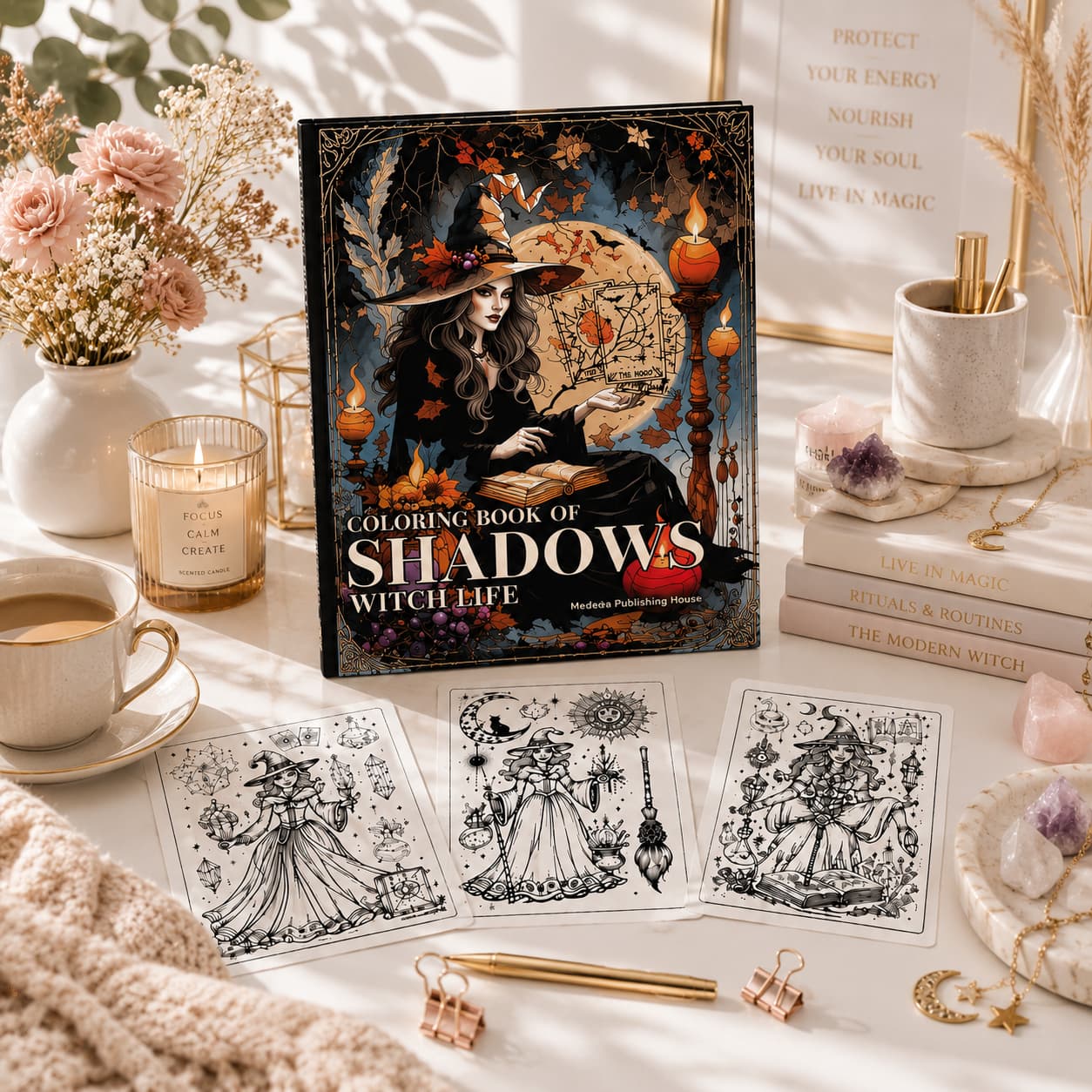 coloring book of shadows witch life printable pages displayed in a bright lifestyle flat lay with candles, crystals and witchy decor