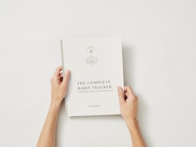 A vibrant pink and red illustration featuring various scenes of affection and romantic symbols, used as a decorative cover for a Complete Habit Tracker Journal.