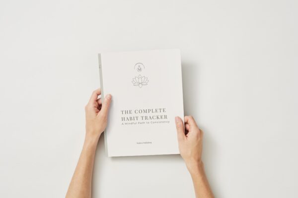 A vibrant pink and red illustration featuring various scenes of affection and romantic symbols, used as a decorative cover for a Complete Habit Tracker Journal.