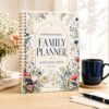 Spiral-bound Homeschool Family Planner and Record Book with an elegant floral cover.